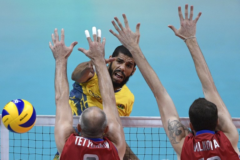 Brazil's Wallace Leandro De Souza spikes the ball during the men's semi-final volleyball match between Russia and Brazil at Maracanazinho Stadium in Rio de Janeiro on August 19, 2016, at the Rio 2016 Olympic Games. / AFP PHOTO / Juan Mabromata