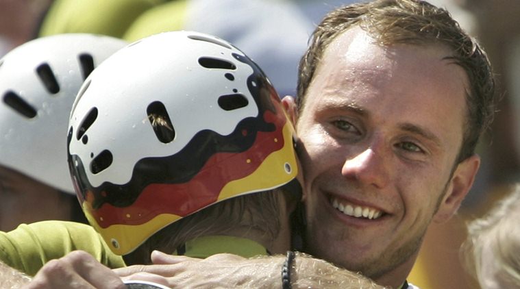 Germany's Stefan Henze (R) celebrates with teammate Marcus Becker after winning the silver medal in the men's canoe double competition at the Athens 2004 Olympic Games August 20, 2004. Henze died on August 15, 2016  from head injuries sustained in a car crash in Rio de Janeiro, during the Rio 2016 Olympic Games. REUTERS/Reinhard Krause/Files
