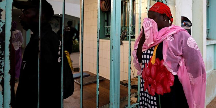 Ndeye Absa Gueye, the grandmother of a ten-day-old baby, reacts as she waits outside the hospital, where newborn babies died in a fire at the neonatal section of a regional hospital in Tivaouane, Senegal, May 26, 2022. REUTERS/Zohra Bensemra