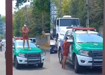 A mulher ficou em cima da viatura e aparentava estar com raiva. Foto: Reprodução