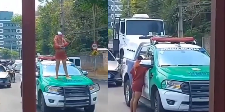 A mulher ficou em cima da viatura e aparentava estar com raiva. Foto: Reprodução