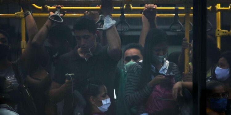 Passengers travel on a public bus amid the coronavirus disease (COVID-19) pandemic, in Rio de Janeiro, Brazil, November 18, 2020. Picture taken November 18, 2020. REUTERS/Ricardo Moraes