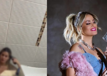 A cantora aparece sentada no chão do banheiro com uma arma apontada para a cabeça. Foto: Reprodução