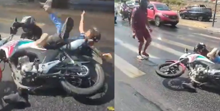 Veja motociclista e passageira caind0 em trecho na avenida Cosme Ferreira coberta por óleo; vídeo