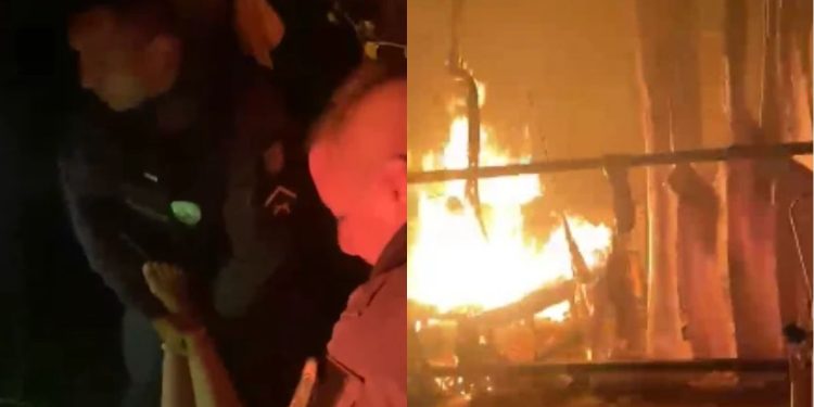Vídeo: Em meio às chamas, policiais entram em casa pegando fogo e salvam mulher desacordada no Amazonas